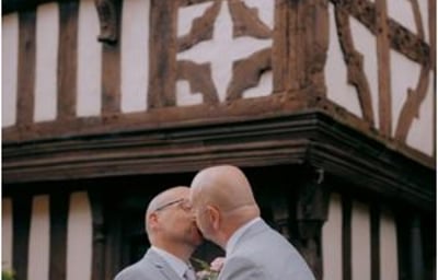 Two Grooms kissing