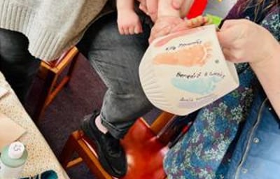 Painting footprints onto a hanging planter