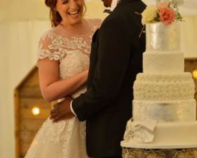 Bride and groom with their wedding cake 
